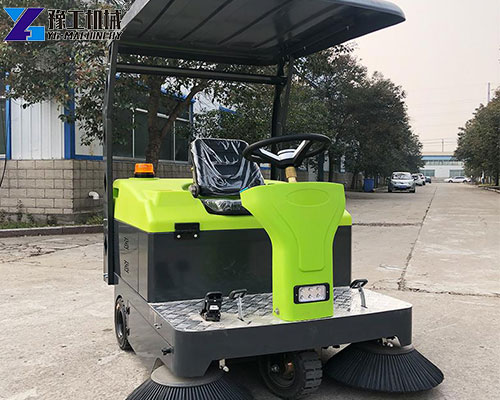 green pavement sweeper